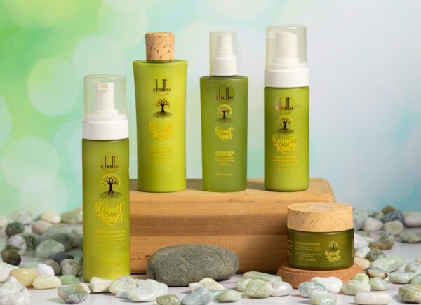 Robust Roots hair care products on rocks.